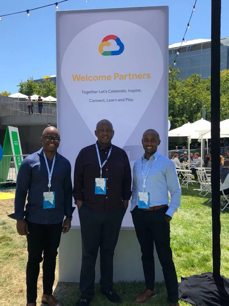 Lubabalo Dyantyi and Baxolile Mabinya with Dr Andile Ngcaba at Google Cloud Next, San Francisco, July 2018