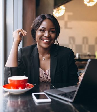 african-american-business-woman-working-cafe-min